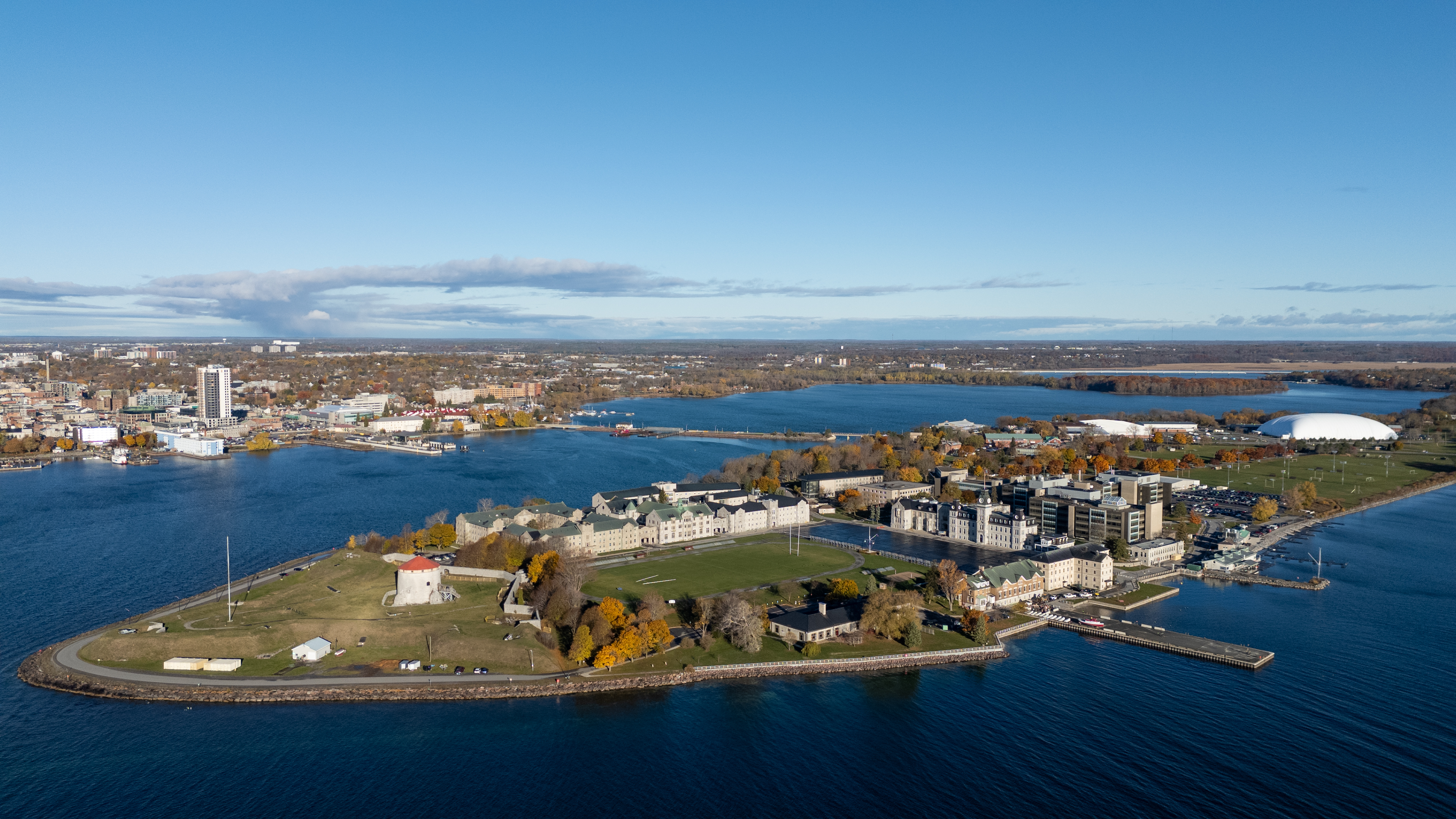 The campus of the Royal military college of Canada sits on Point Frederick peninsula with downtown Kingston across its harbour.